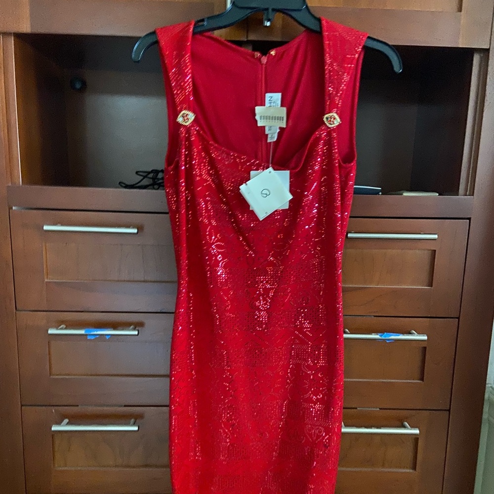 Never been worn St. John classic “ Go Red dress “ size 2 still have $930 tags